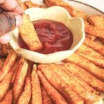 Celeriac or celery root fries served with some ketchup.