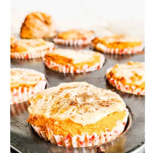 Keto Pumpkin cream cheese muffins on a muffin tray.