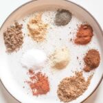 Burger seasoning ingredients on a plate.