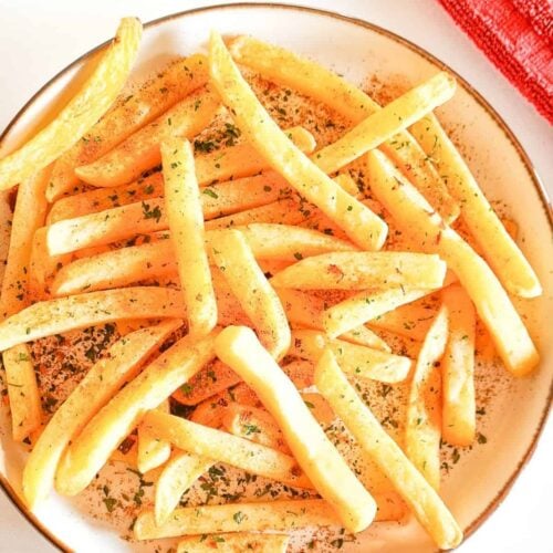 A plate of seasoned chips (french fries)