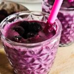 Photo showing a glass of keto blueberry smoothie.