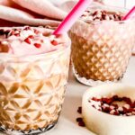 A side photo of red velvet latte with some sprinkles on the side
