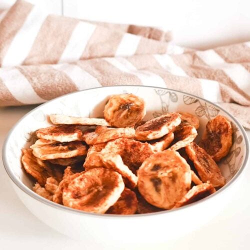 A bowl of air fryer dehydrated banana chips.