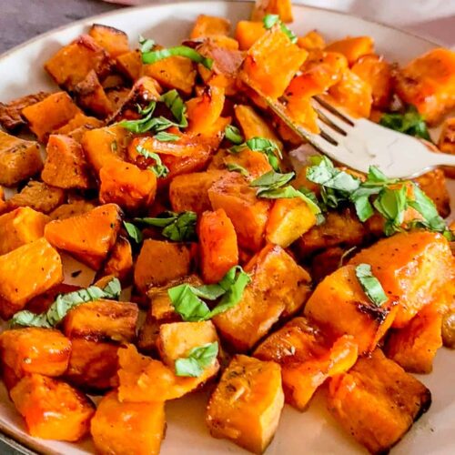 Air fried sweet potato chunks served on a plate.