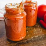 A picture showing two jars of pilipili ya kukaanga sauce.