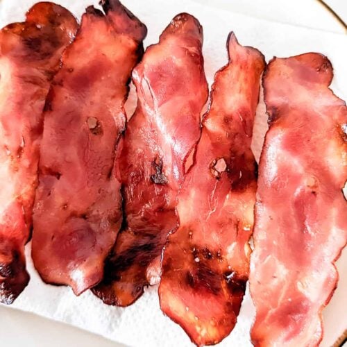 Rashers of turkey bacon on a paper napkin.
