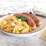 A plate of Wirsing served with Bratwurst