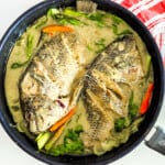 Filipino tilapia in coconut fish (Ginataang tilapia).