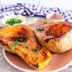 A close up picture of air fried butternut squash halves.