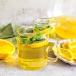 A side image of Kalte Ente drink along with slices of lemon.