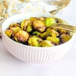 A close up photo of air fryer brussel sprouts in a small bowl.