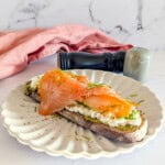A picture of cottage cheese toast with avocado and salmon