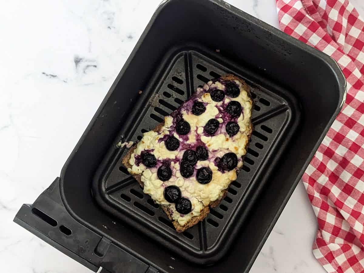 Blueberry cottage cheese toast cooked at 180°C (350°F) inside an air fryer.