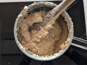 Cooked oat fufu in a pot.