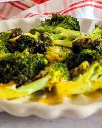 Crispy air fried broccoli served on a plate.