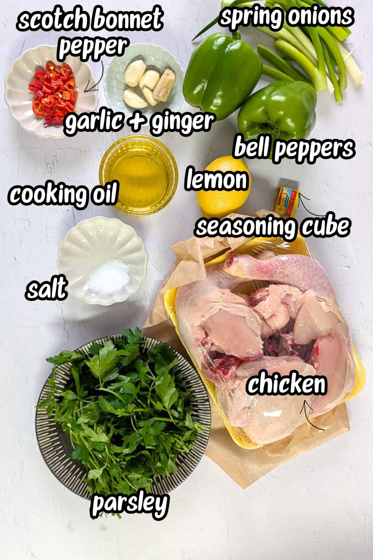 A flat lay of ingredients for cooking Yassa chicken.