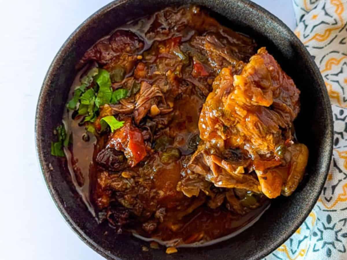 Slow-cooked South African oxtail stew with vegetables and rich sauce.